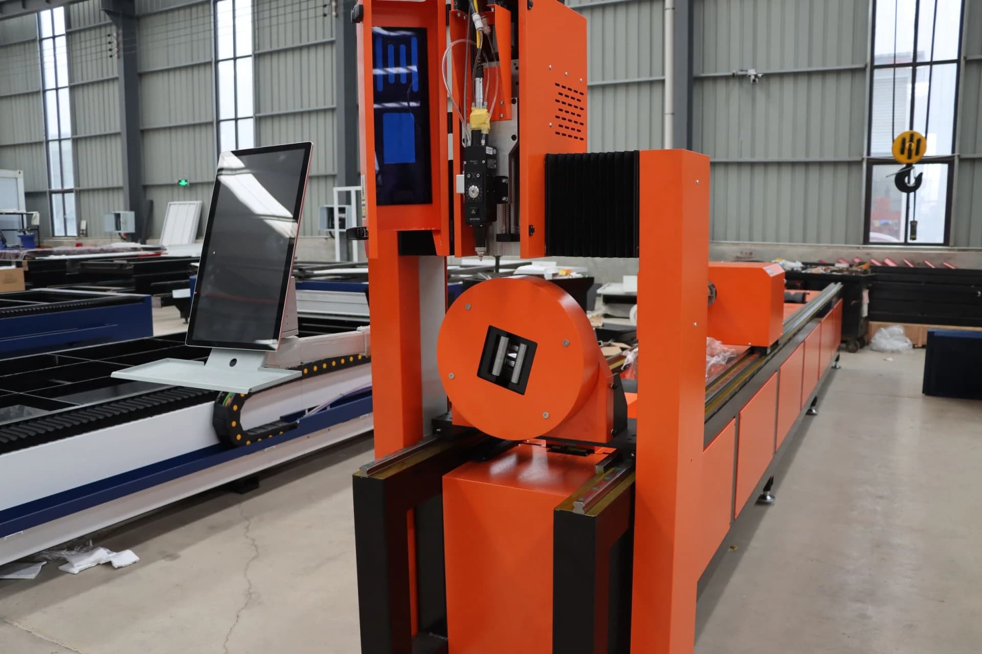 Modern large-format laser cutting machine on a sheet metal factory floor